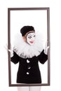 A female clown in a frame is looking angry Royalty Free Stock Photo