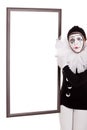 Female clown shows an empty frame Royalty Free Stock Photo