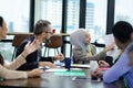 Young team of coworkers making great business discussion in modern co working office