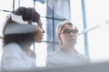 Female colleagues of different nationalities and ages met in the office hall Royalty Free Stock Photo