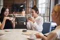 Female colleagues relaxing at their office cafe Royalty Free Stock Photo