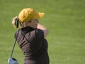 Female College Golfer Swinging Fairway Wood Royalty Free Stock Photo