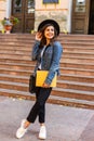 Female college student with books outdoors in the street. Smiling school girl with books standing at campus. Portrait of perfect Royalty Free Stock Photo