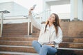 Female college student with books outdoors. Smiling school girl with books standing at campus. I& x27;m prepared for exam Royalty Free Stock Photo