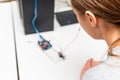 Female College Student Building Machine In Science Robotics Or Engineering Class.Stem education.Closeup Royalty Free Stock Photo