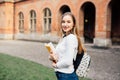 Female college student. Happy girl in european university for scholarship. Royalty Free Stock Photo