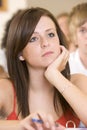 Female college student listening to a lecture Royalty Free Stock Photo