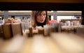 female college student in a llibrary Royalty Free Stock Photo