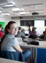 female college student sitting in a classroom Royalty Free Stock Photo