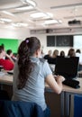 Female college student sitting in a classroom Royalty Free Stock Photo