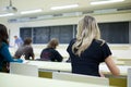 Female college student sitting in a classroom