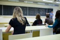 Female college student sitting in a classroom