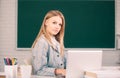 Female college student working on a laptop in classroom, preparing for an exam. Webinar e-learning at school, distance Royalty Free Stock Photo