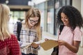 Female College Students Opening Exam Results