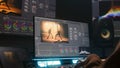 Female colorist makes film color correction using PC software