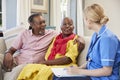 Female Community Nurse Visits Senior Couple At Home Royalty Free Stock Photo