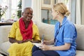 Female Community Nurse Visits Senior Woman At Home Royalty Free Stock Photo