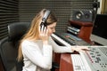 Female composer listening her new track Royalty Free Stock Photo
