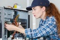 Female computer engineer repairing computer Royalty Free Stock Photo