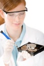 Female computer engineer - woman repair hard disc Royalty Free Stock Photo