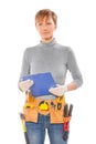 female construction contractor with tools in belt holding clipboard isolated on white background Royalty Free Stock Photo