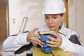 Female construction fixing sanding machine Royalty Free Stock Photo
