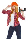 Female construction worker in a hard hat with a perforator Royalty Free Stock Photo