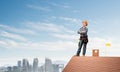 Female construction worker in hardhat standing Royalty Free Stock Photo