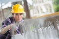 Female construction worker installing binding steel wires