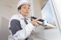 Female construction worker installing window in house Royalty Free Stock Photo