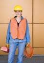 Female construction worker posing in hard-hat