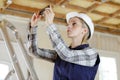 Female construction worker taking photo cell phone Royalty Free Stock Photo