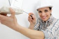 female construction worker using screw driver Royalty Free Stock Photo