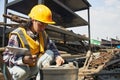 Female construction workers checking old industrial batteries Royalty Free Stock Photo