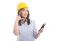 Female constructor holding phone showing calling gesture