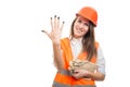 Female constructor rising five fingers up