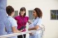 Female Consultant Meeting With Nurses Using Digital Tablet Royalty Free Stock Photo