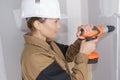 female contractor using cordless drill Royalty Free Stock Photo