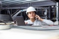female contractor using laptop in roofspace Royalty Free Stock Photo