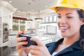 Female Contractor Texting on Phone Over Kitchen Drawing Gradating to Photo Royalty Free Stock Photo