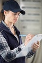 female contractor writing on clipboard Royalty Free Stock Photo