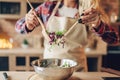 Female cook in apron prepares fresh salad Royalty Free Stock Photo