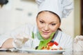 female cook chef decorating prepared salad food Royalty Free Stock Photo