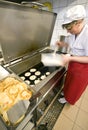 Female cook in kitchen Royalty Free Stock Photo