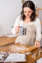 Female cook roll out the dough. Preparation of shortbread dough for cookies. Homemade cake Royalty Free Stock Photo