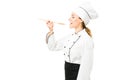 Female cook savoring some soup at the kitchen restaurant Royalty Free Stock Photo