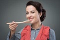 Female cook tasting a recipe