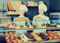 Female cooks demonstrating and selling pastry in the cafe