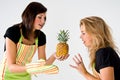 Female cooks and pineapple Royalty Free Stock Photo