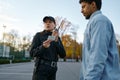 Female cop checking male passerby ID document